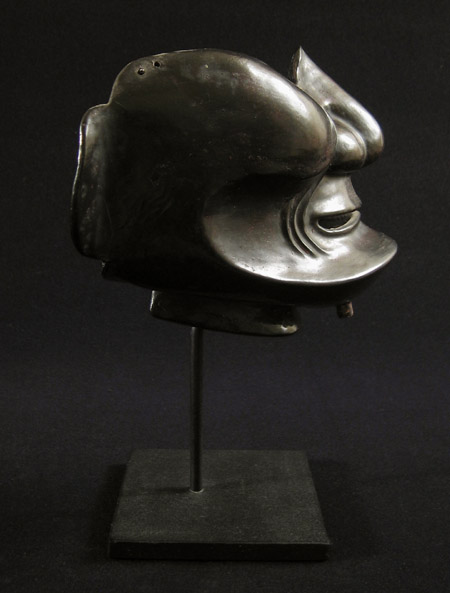Asian Tribal Art - Leather mempo, Japan, left